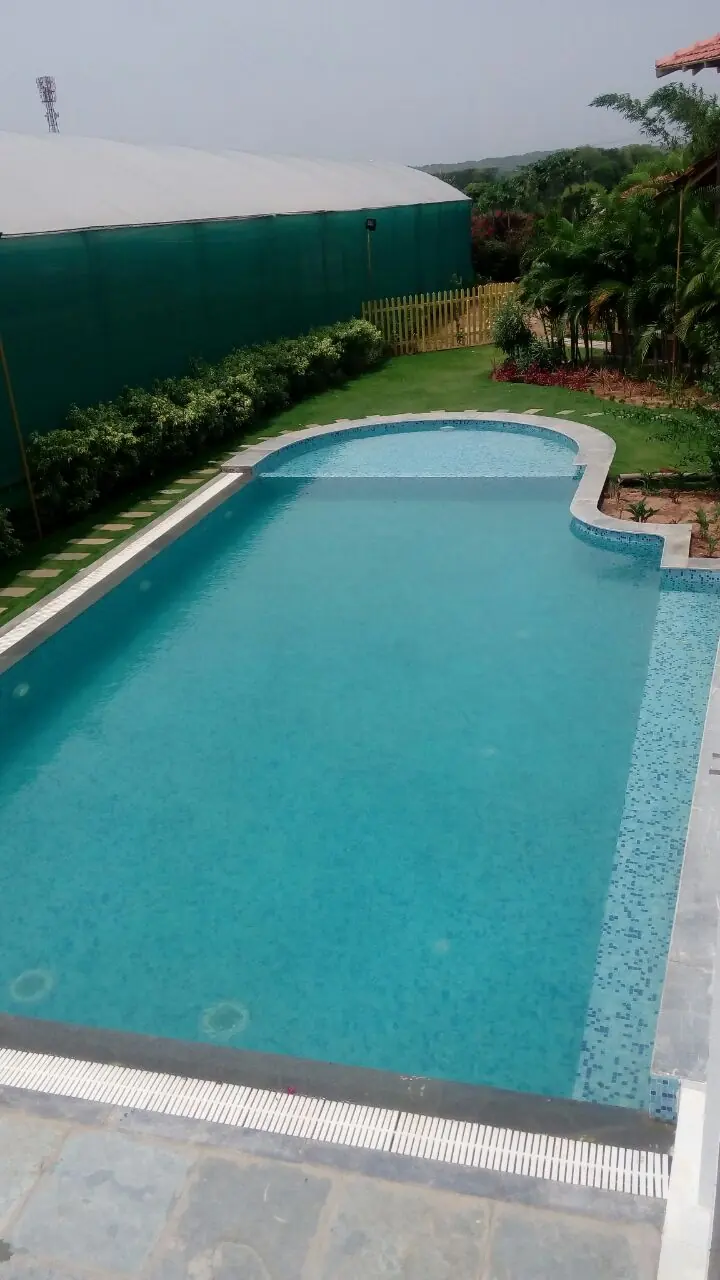 Farmhouse pool with kids’ cove